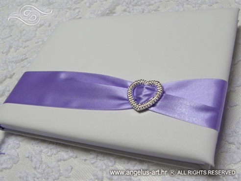 wedding guestbook with brooch and lilac ribbon