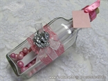 pink invitation for baptism in a bottle with a silver angel