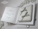 hardcovered book as a wedding rings pad