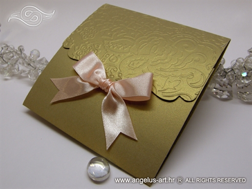 gold wedding invitation with peach bow